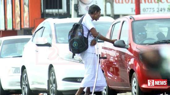 ට්රැෆික් ලයිට්ස් වලදී යාචකයන්ට මුදල් ලබා දුන්නොත් දඬුවම්