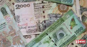 අලුත් රුපියල් දෙදාහේ කොලයක් එළියට ?